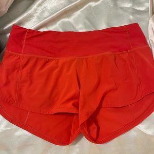 Lululemon red orange speed up 2.5” shorts